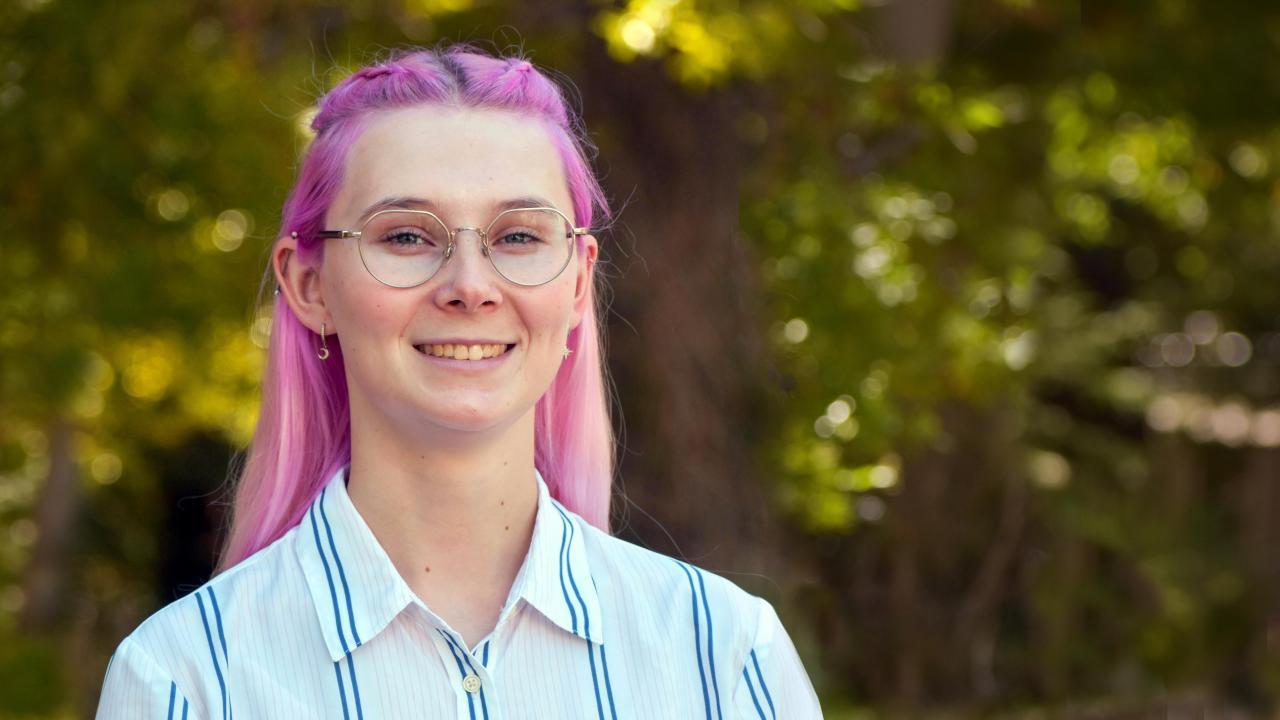 A person smiling for a picture.