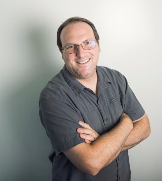 A person smiling for a picture.