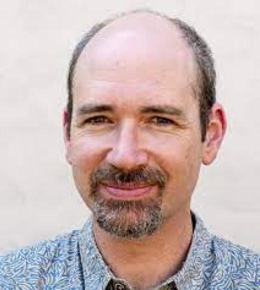 A person smiling for a picture.