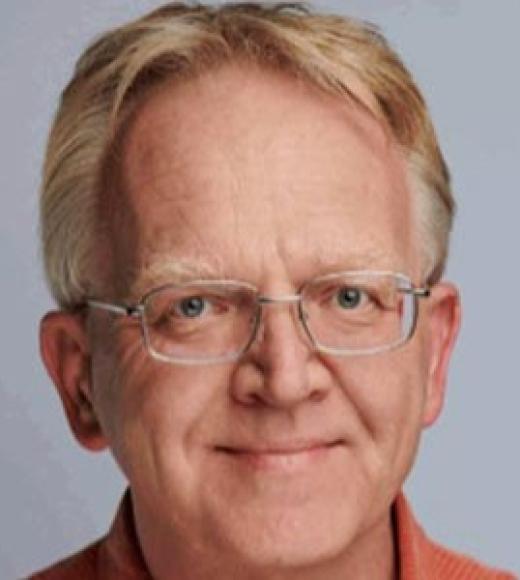 A person smiling for a picture.