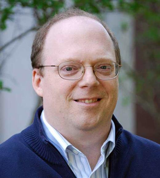A person smiling for a picture.