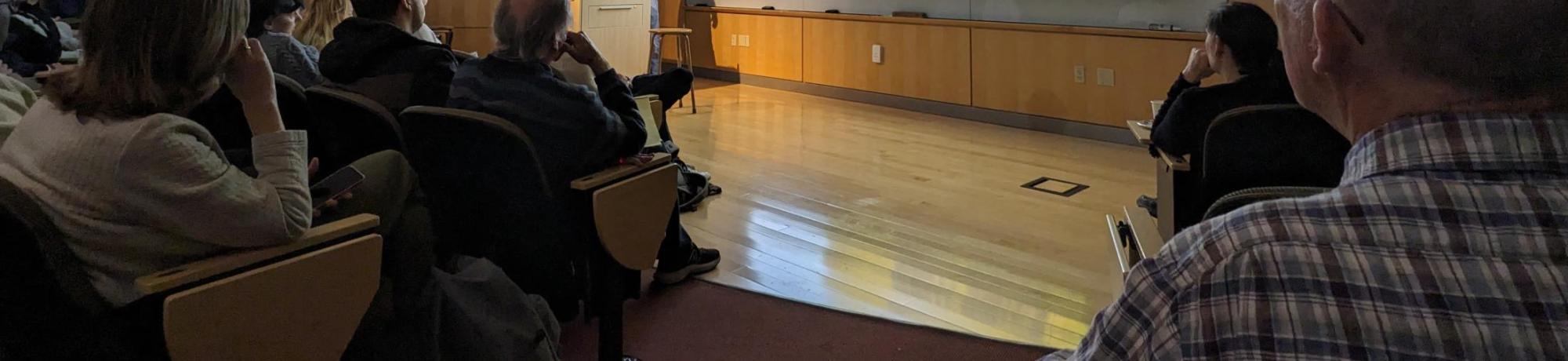 A picture of a lecture in an auditorium.