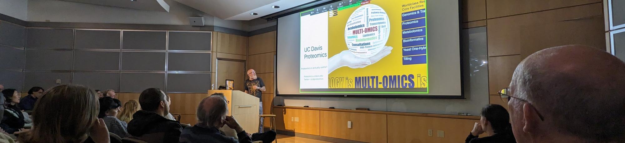 A picture of a lecture in an auditorium.